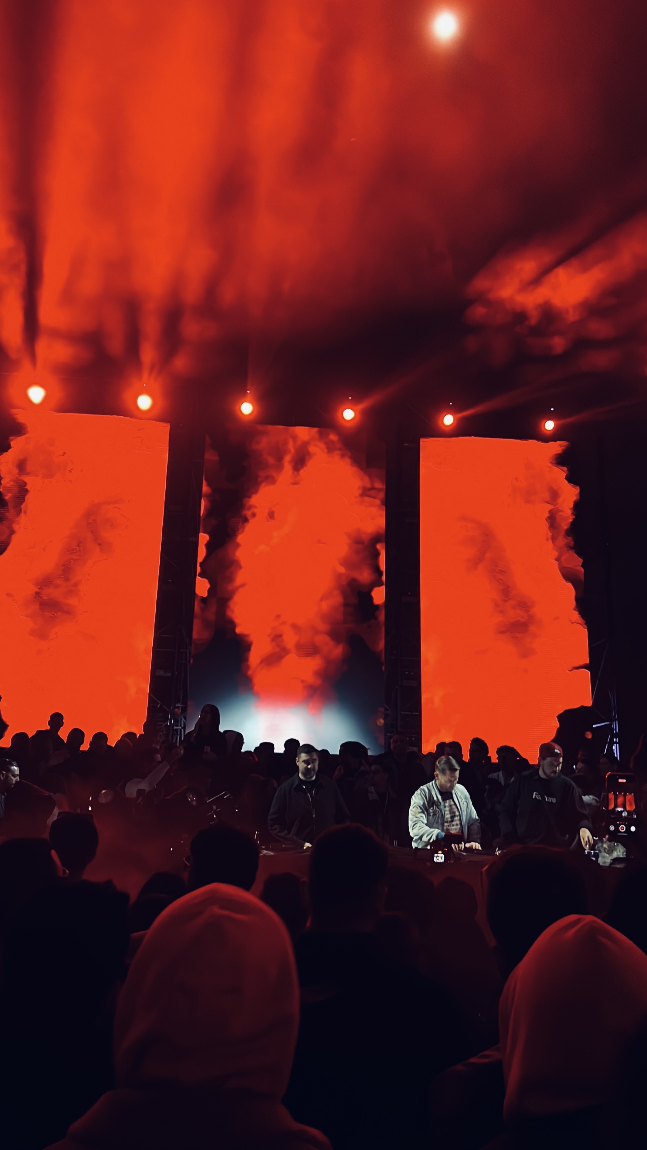 Red-lit stage with smoke effects
